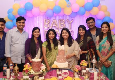 Baby shower catering setup with pastel décor and themed food